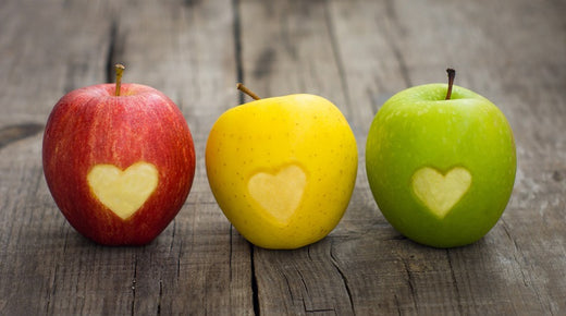 three apples on a table