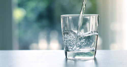 water pouring into a glass