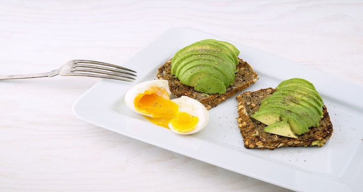 boiled egg and avacado on crispbread