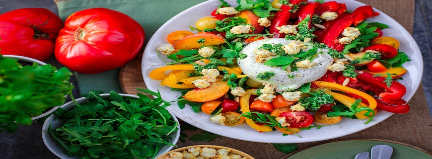 leafy green salad in a white bowl