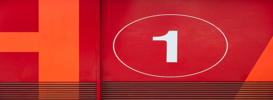 The number one, in white, against a red backdrop