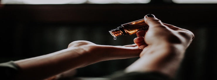 person applying lotion to hand