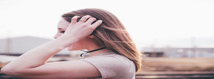 stressed woman running hand through hair