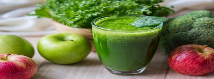 green drink with apple and green leaves