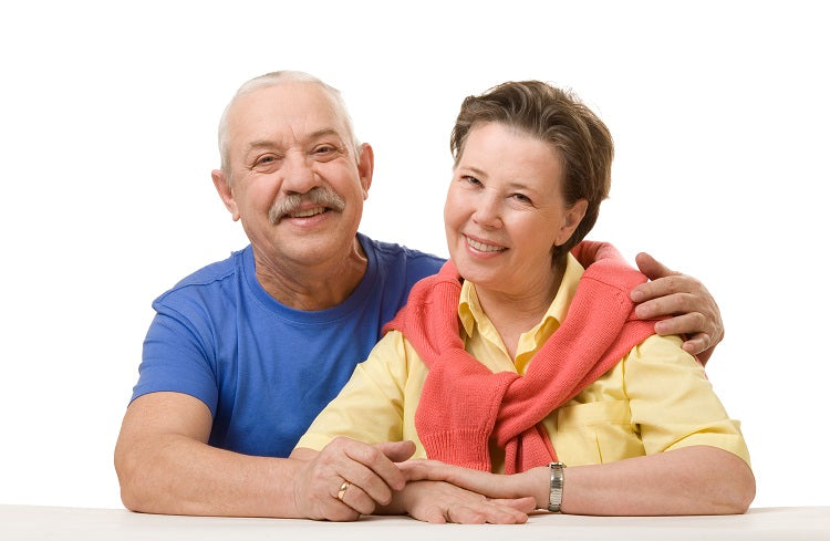 older man and woman sitting at table